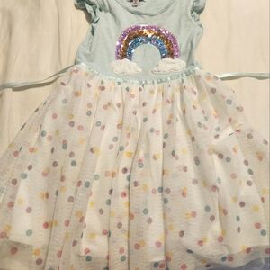 VGC. Featuring a rainbow sequin and darling flutter sleeves